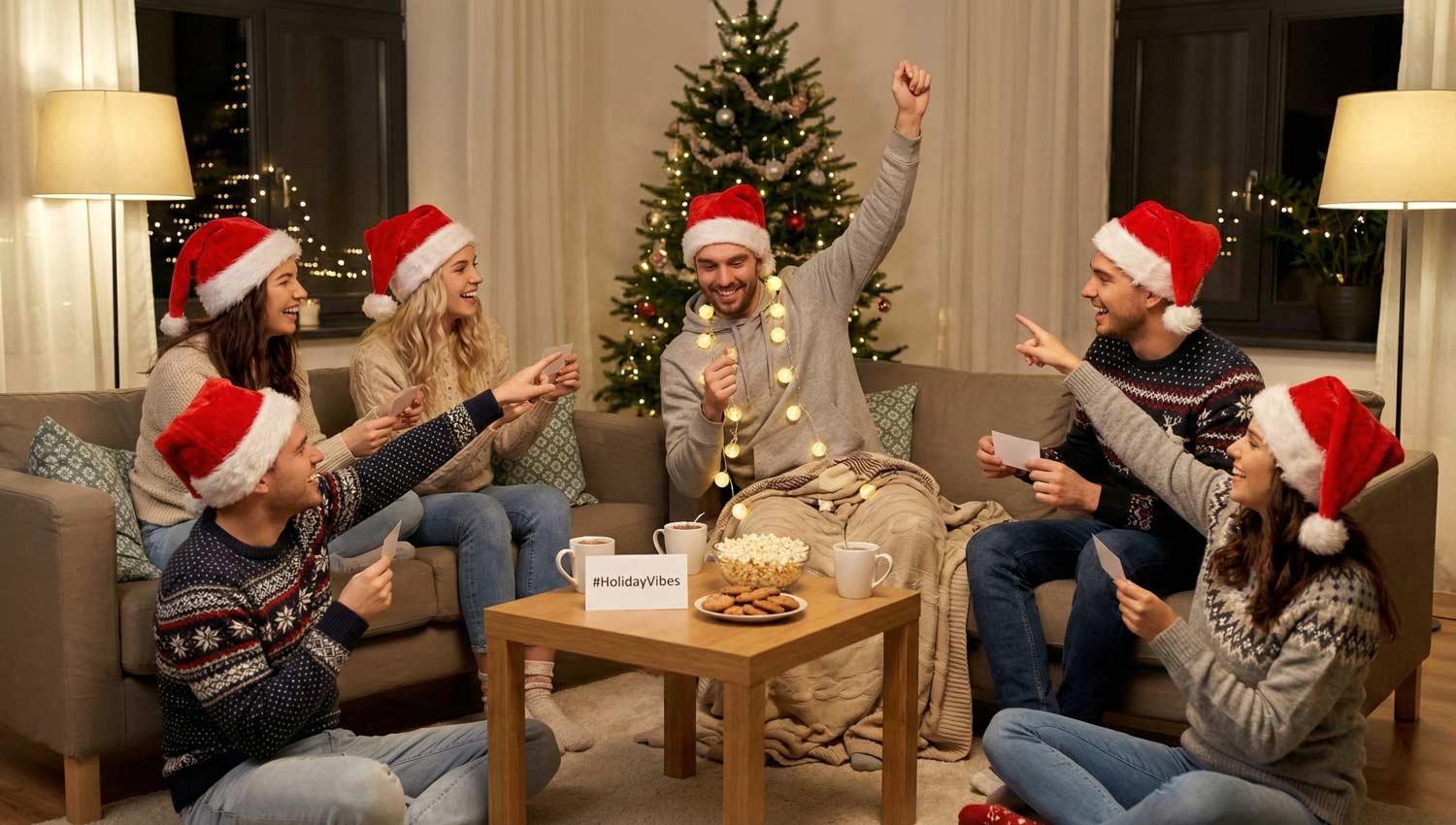 Friends in Santa hats playing seasonal round